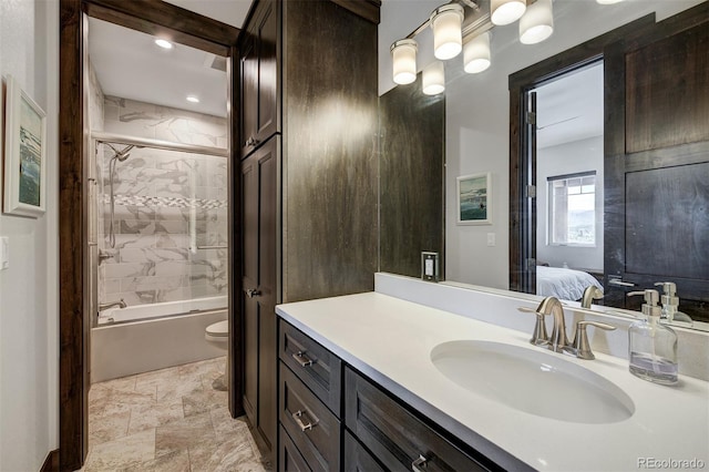 701 Saddle Ridge Cir, Granby, CO 80446 - ensuite bathroom featuring vanity, toilet, combined bath / shower with glass door, stone finish flooring, and recessed lighting