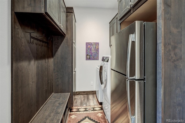 701 Saddle Ridge Cir, Granby, CO 80446 - laundry area with light wood-style flooring and washer and clothes dryer