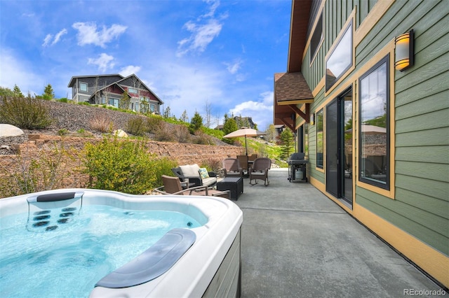 701 Saddle Ridge Cir, Granby, CO 80446 - view of patio / terrace with a hot tub and area for grilling