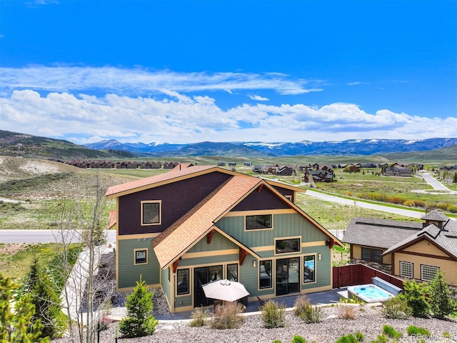 701 Saddle Ridge Cir, Granby, CO 80446 - view of front of home featuring a mountain view and a patio