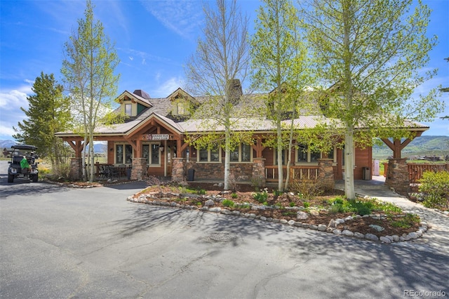 701 Saddle Ridge Cir, Granby, CO 80446 - view of front of property featuring covered porch and stone siding