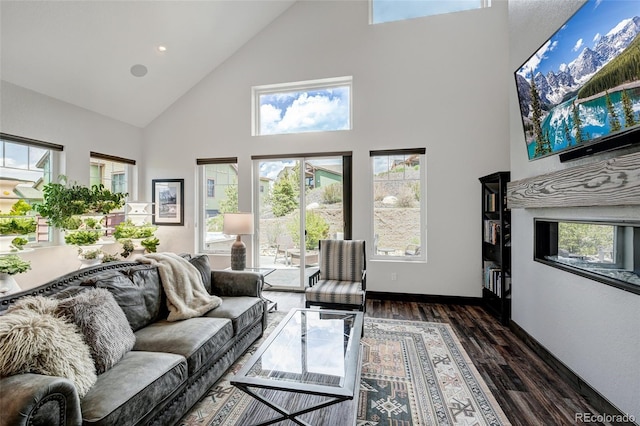 701 Saddle Ridge Cir, Granby, CO 80446 - living area with high vaulted ceiling, wood finished floors, healthy amount of natural light, baseboards, and recessed lighting