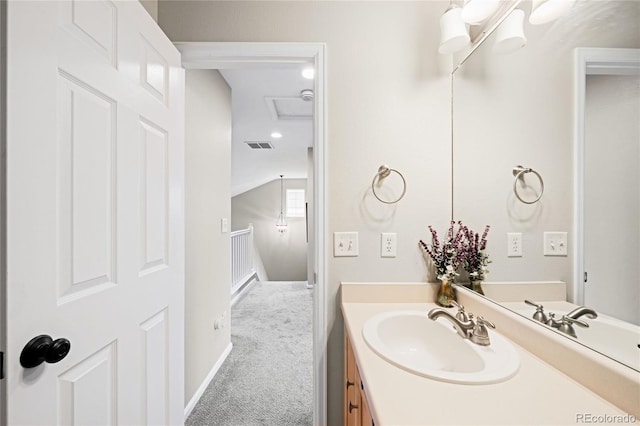 bathroom with vanity and baseboards
