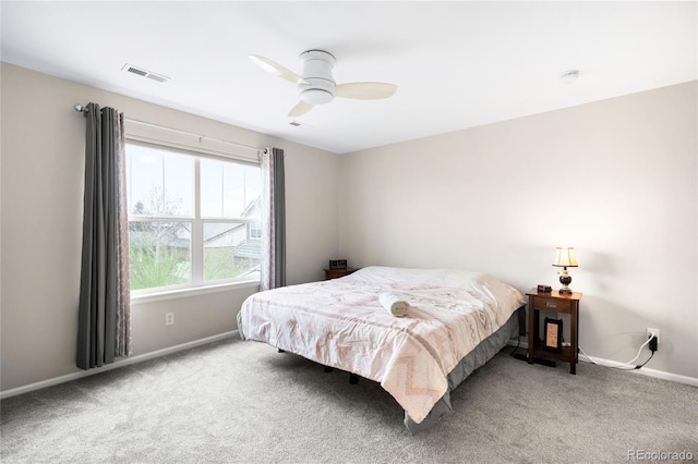bedroom featuring carpet floors, baseboards, and a ceiling fan