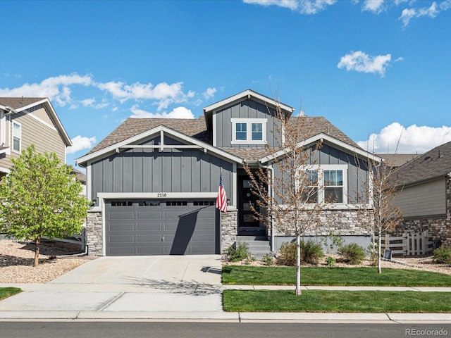 27110 E Fremont Pl, Aurora, CO 80016 - craftsman inspired home featuring board and batten siding, concrete driveway, a garage, a shingled roof, and stone siding