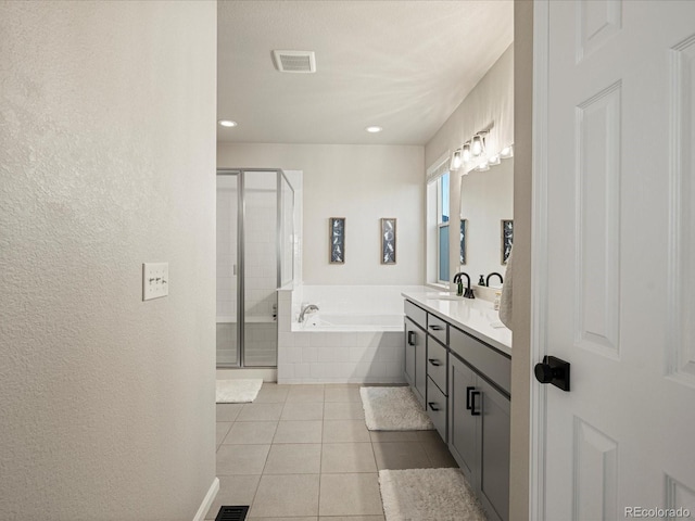 27110 E Fremont Pl, Aurora, CO 80016 - full bath with tile patterned floors, a bath, a stall shower, vanity, and recessed lighting