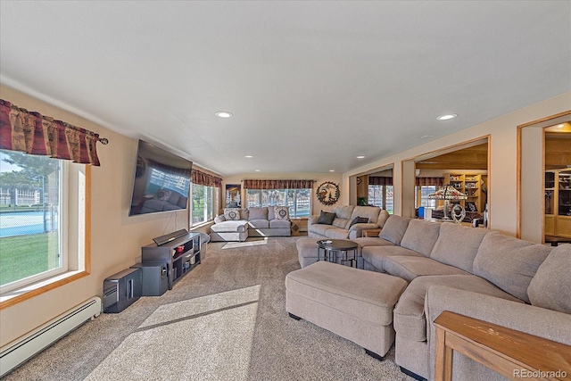 carpeted living room featuring baseboard heating