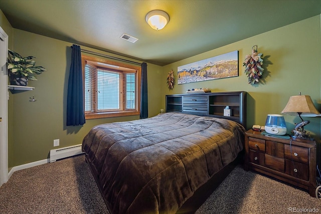 carpeted bedroom with a baseboard heating unit