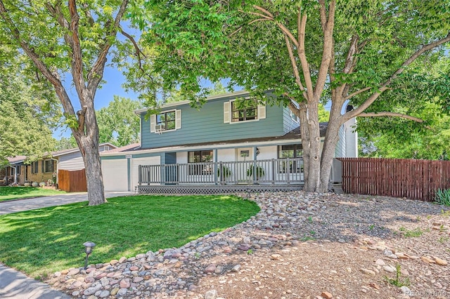 6494 W 85th Ave, Arvada, CO 80003 - view of front of home with covered porch, driveway, and an attached garage