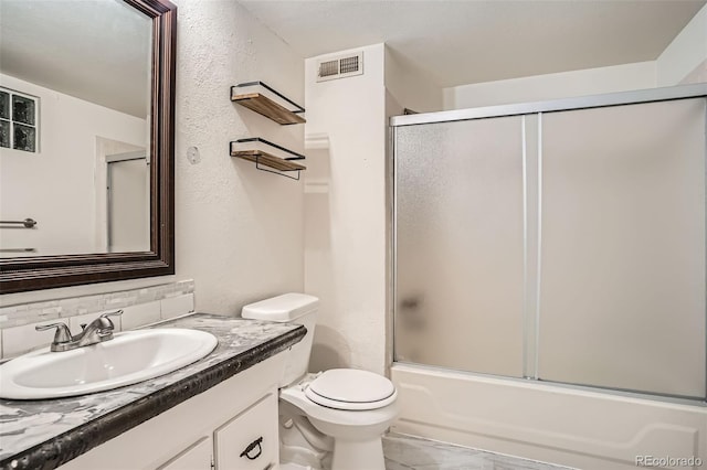 6494 W 85th Ave, Arvada, CO 80003 - full bathroom featuring vanity, shower / bath combination with glass door, a textured wall, and backsplash