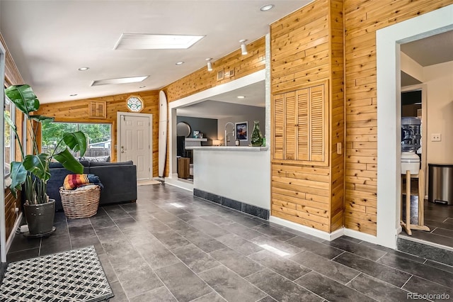 6494 W 85th Ave, Arvada, CO 80003 - welcome area featuring wood walls, recessed lighting, and a skylight