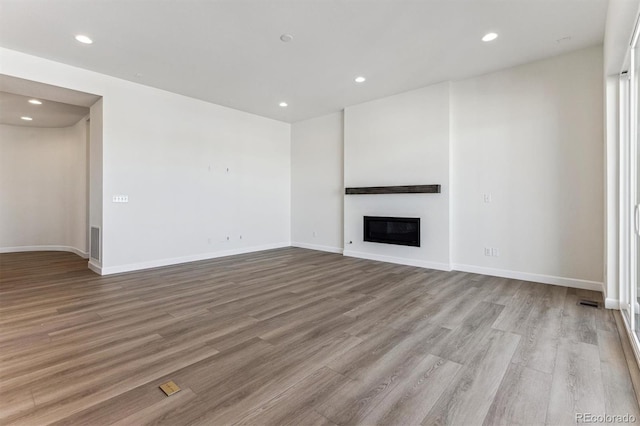 unfurnished living room featuring light wood-type flooring