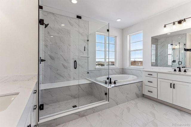 bathroom featuring vanity and plus walk in shower