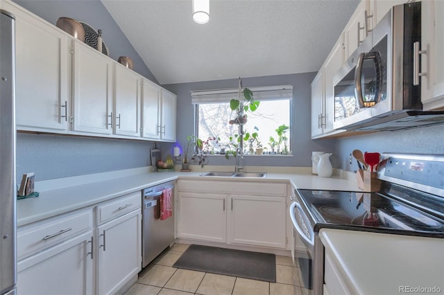 kitchen featuring white cabinetry, appliances with stainless steel finishes, sink, and a textured ceiling