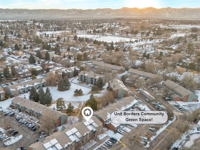 snowy aerial view with a mountain view