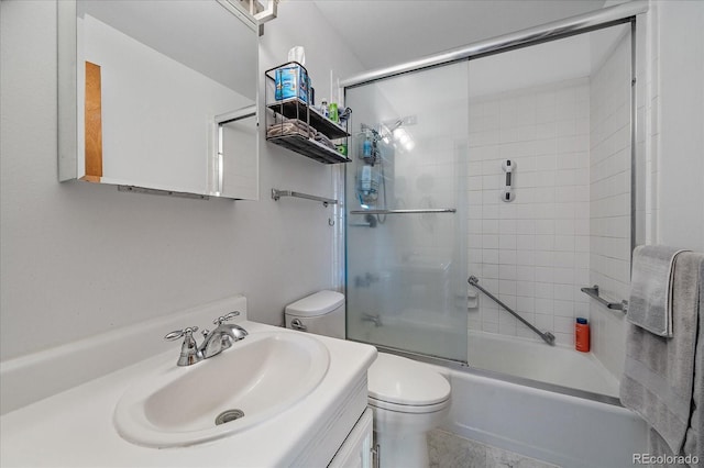 31270 John Wallace Rd Unit 310, Evergreen, CO 80439 - full bathroom featuring toilet, bath / shower combo with glass door, and vanity