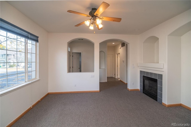 unfurnished living room featuring a fireplace and carpet floors