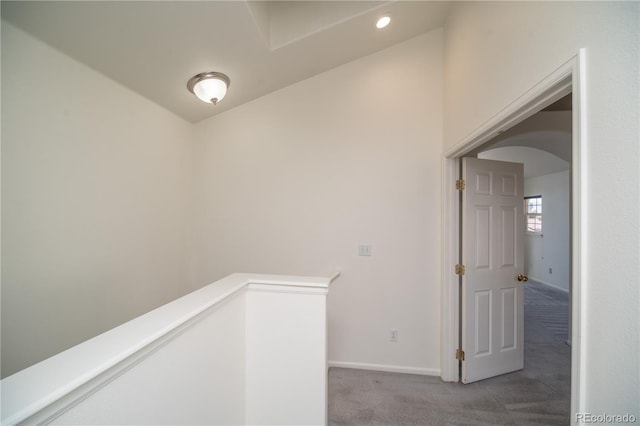 hallway with light carpet