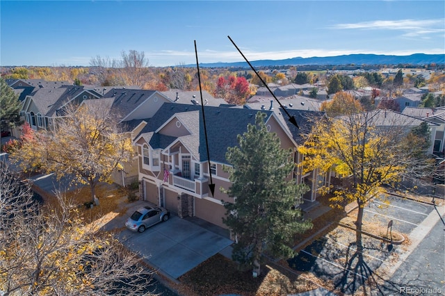 birds eye view of property with a mountain view