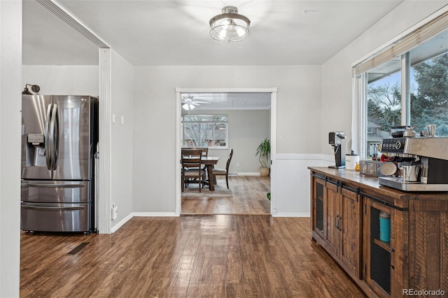 7636 S Eaton Way, Littleton, CO 80128 - kitchen with stainless steel fridge, wood finished floors, wainscoting, and ceiling fan