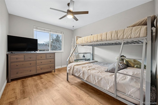 bedroom featuring light wood-type flooring and ceiling fan