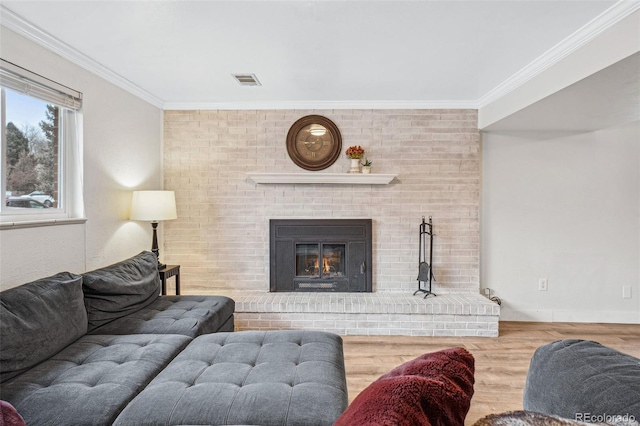 7636 S Eaton Way, Littleton, CO 80128 - living room with crown molding, wood finished floors, and a fireplace