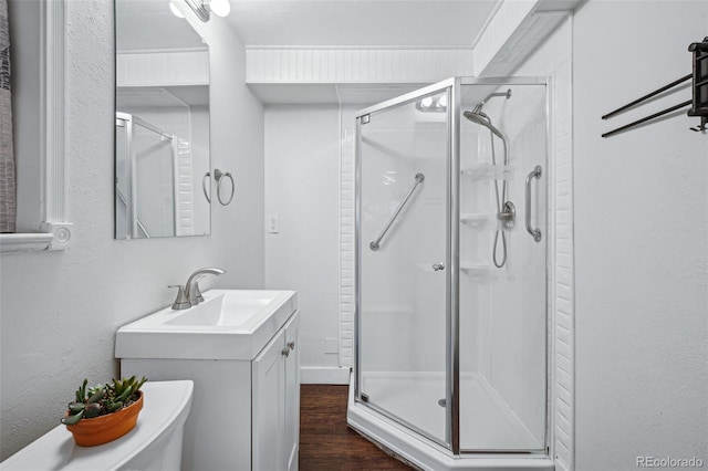 7636 S Eaton Way, Littleton, CO 80128 - full bathroom with a shower stall, wood finished floors, and vanity