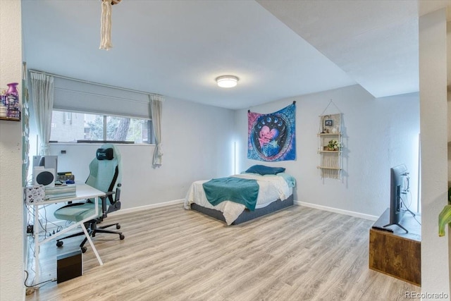 5300 E Cherry Creek S Drive 804, Denver, CO 80246 - bedroom with wood finished floors, baseboards, and a desk