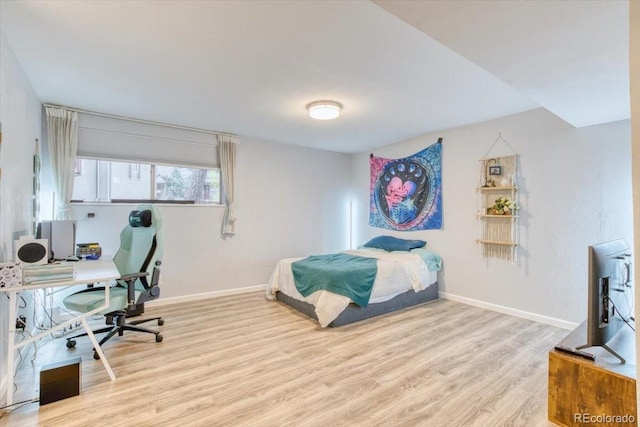 5300 E Cherry Creek S Drive 804, Denver, CO 80246 - bedroom featuring wood finished floors, baseboards, and a desk