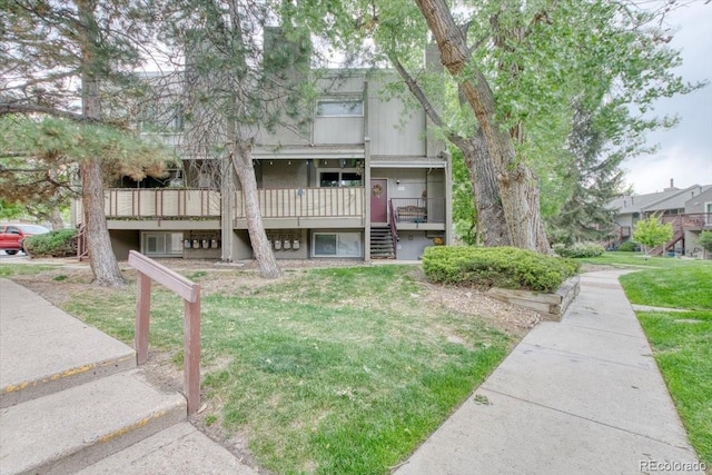 5300 E Cherry Creek S Drive 804, Denver, CO 80246 - view of front of home with stairway, a front yard, a wooden deck, and central air condition unit