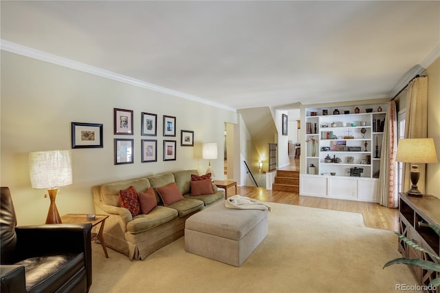 living room featuring ornamental molding and light hardwood / wood-style floors