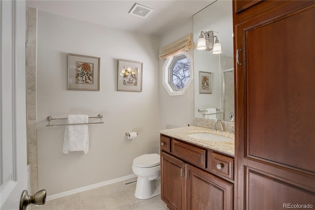 bathroom featuring an enclosed shower, vanity, and toilet