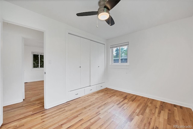 6765 W 33rd Ave, Wheat Ridge, CO 80033 - unfurnished bedroom with light wood-style floors, a closet, and ceiling fan