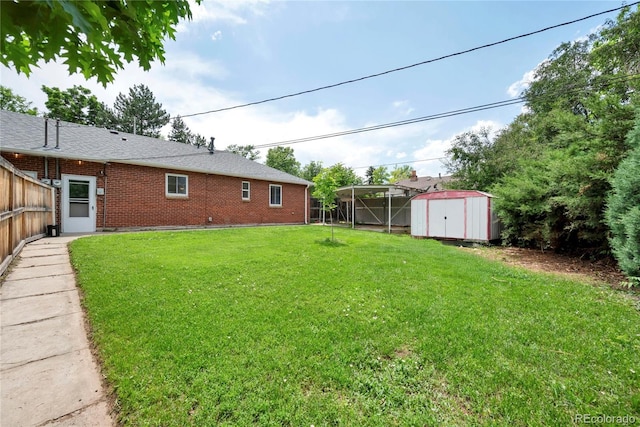 6765 W 33rd Ave, Wheat Ridge, CO 80033 - view of yard featuring a storage unit