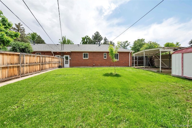 6765 W 33rd Ave, Wheat Ridge, CO 80033 - rear view of property featuring a shed, a fenced backyard, and brick siding