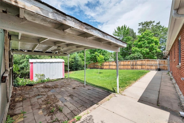 6765 W 33rd Ave, Wheat Ridge, CO 80033 - view of patio featuring a storage unit