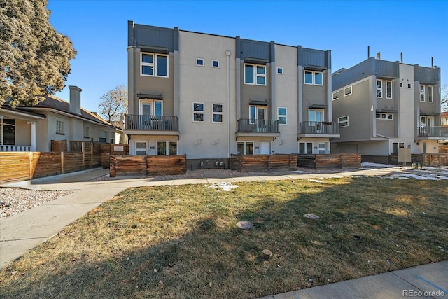 exterior space with a residential view and fence