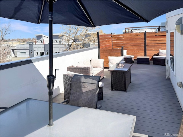 wooden deck with outdoor lounge area