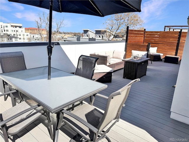 wooden deck featuring outdoor dining space and outdoor lounge area