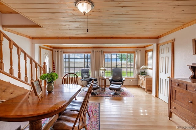 39 Granada Ct, Silver Cliff, CO 81252 - dining room featuring crown molding, wood ceiling, stairs, and light wood-style flooring
