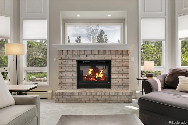 7472 S Utica St, Littleton, CO 80128 - living area with a brick fireplace, a baseboard radiator, plenty of natural light, carpet, and recessed lighting