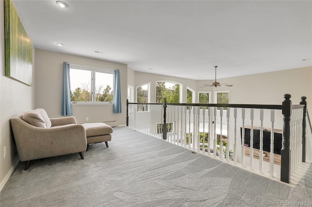 7472 S Utica St, Littleton, CO 80128 - living area with carpet floors, ceiling fan, and baseboards