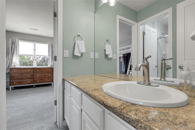 7472 S Utica St, Littleton, CO 80128 - full bathroom featuring vanity, a shower with door, and a walk in closet