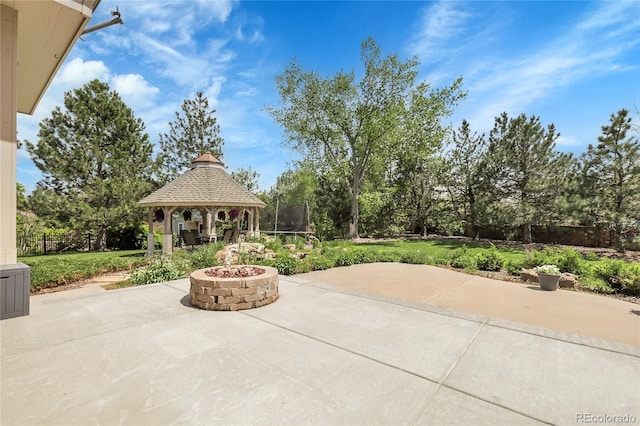 7472 S Utica St, Littleton, CO 80128 - view of patio featuring a gazebo, a fire pit, and view of scattered trees