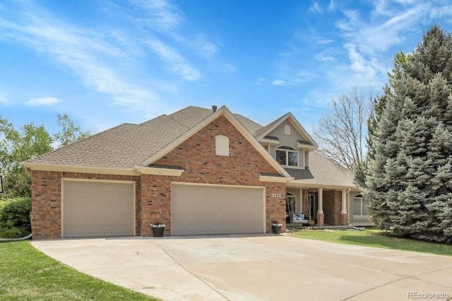 7472 S Utica St, Littleton, CO 80128 - traditional-style house featuring a garage, driveway, brick siding, and a shingled roof