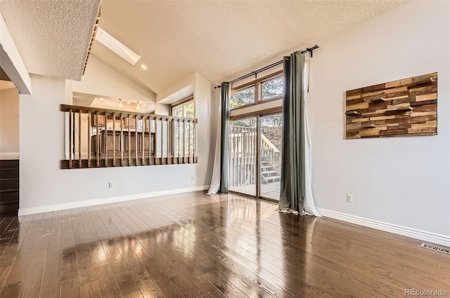 8159 Lodgepole Trl, Lone Tree, CO 80124 - unfurnished room featuring lofted ceiling, wood-type flooring, a textured ceiling, and baseboards