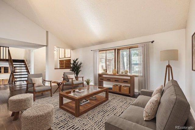 8159 Lodgepole Trl, Lone Tree, CO 80124 - living area with wood finished floors, vaulted ceiling, stairs, and baseboards