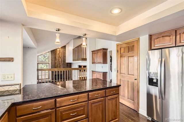 8159 Lodgepole Trl, Lone Tree, CO 80124 - kitchen featuring stainless steel refrigerator with ice dispenser, a raised ceiling, dark wood finished floors, dark stone counters, and recessed lighting