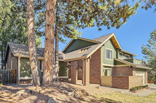 8159 Lodgepole Trl, Lone Tree, CO 80124 - view of front facade with brick siding, a shingled roof, and an attached garage