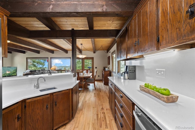 32462 Lodgepole Dr, Evergreen, CO 80439 - kitchen featuring a wooden ceiling with exposed beams, light wood-style floors, light countertops, and decorative light fixtures